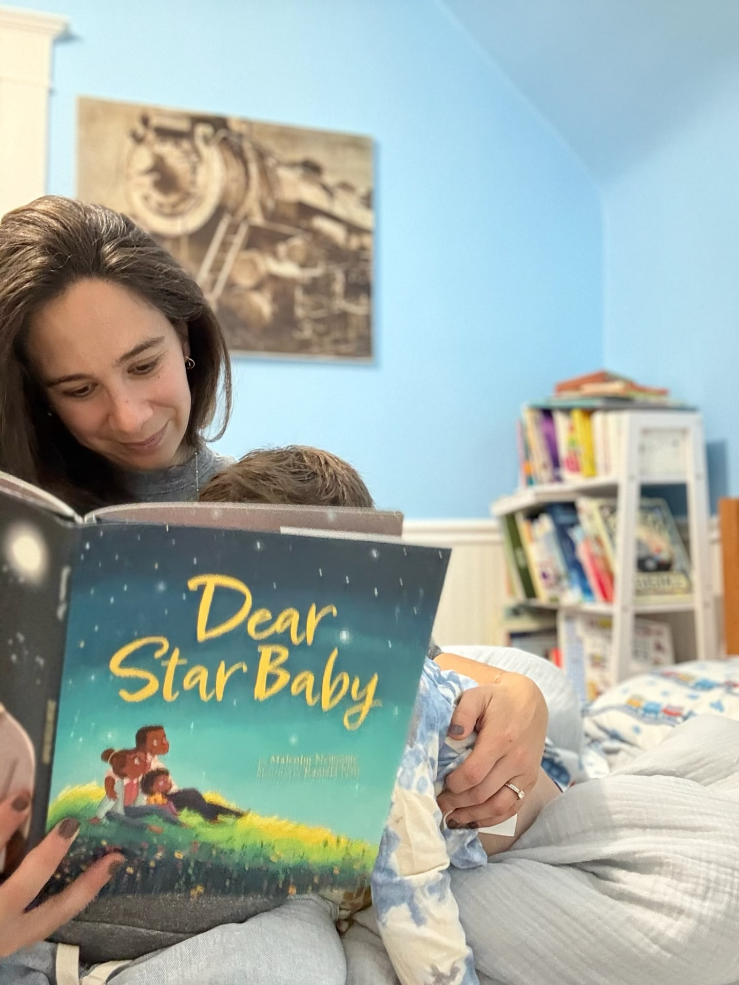 Jenna reading Dear Star Baby with her son